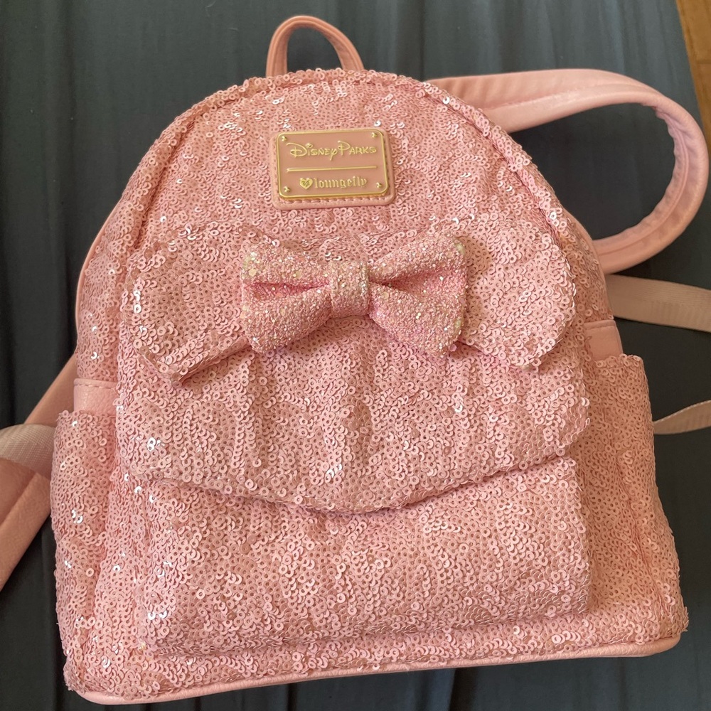 Millennial pink loungefly backpack.